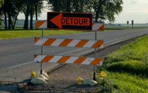 Detour sign on a construction barrier