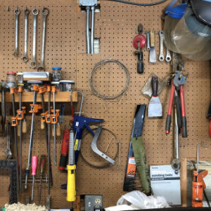 Workshop tools on a pegboard
