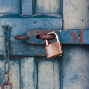 A padlock on a blue door